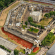 A sea of red ceramic poppies which form part of an art installation to commemorate World War I is seen in the dry moat of the Tower of London in London, Monday, Aug. 4, 2014. The installation of 888,246 ceramic poppies by ceramic artist Paul Cummins and entitled "Blood Swept Lands and Seas of Red" will be unveiled on August 5 to mark the centenary of World War I, with the final one being planted on Armistice Day on November 11. Each poppy represents a British military fatality from World War I. (AP Photo/Rob Taggart)